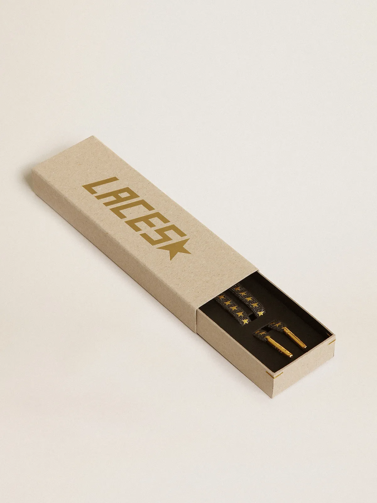 Dark gray Lurex laces with contrasting gold stars