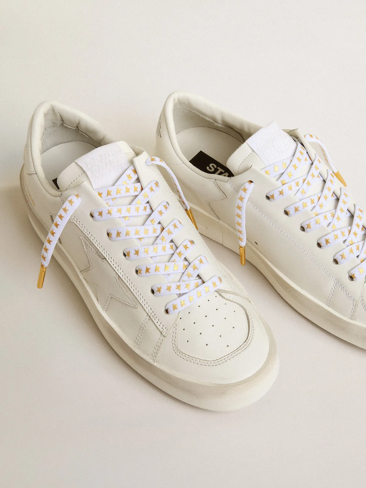 White laces with gold stars